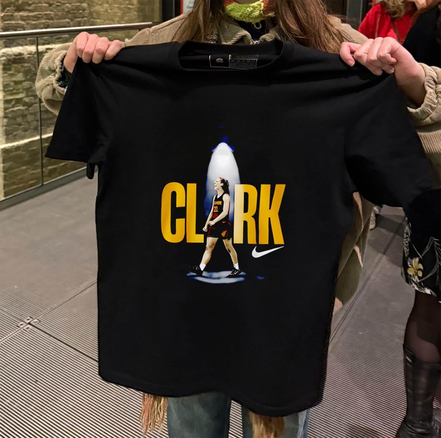 Caitlin Clark stage lights shirt