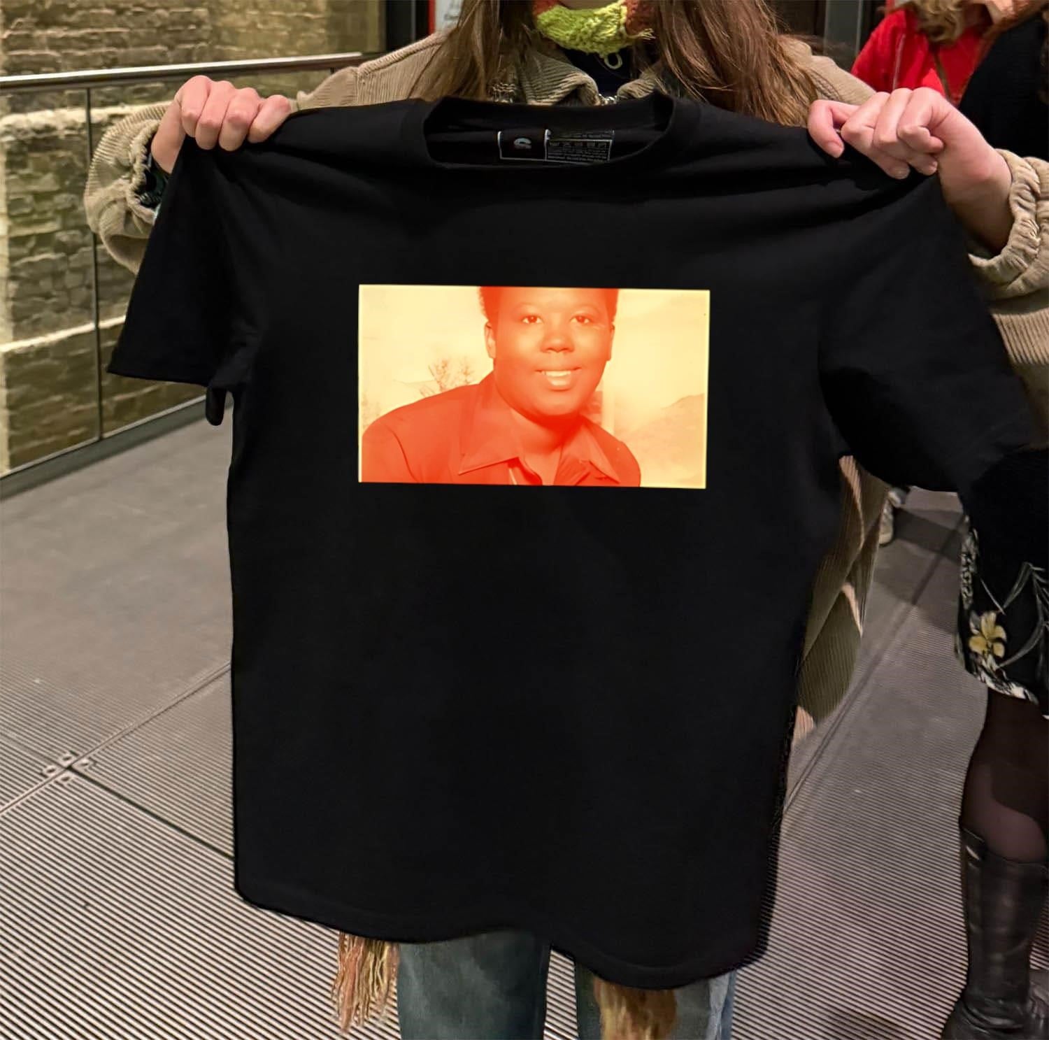 King Harris wear Sabrina Jackson shirt