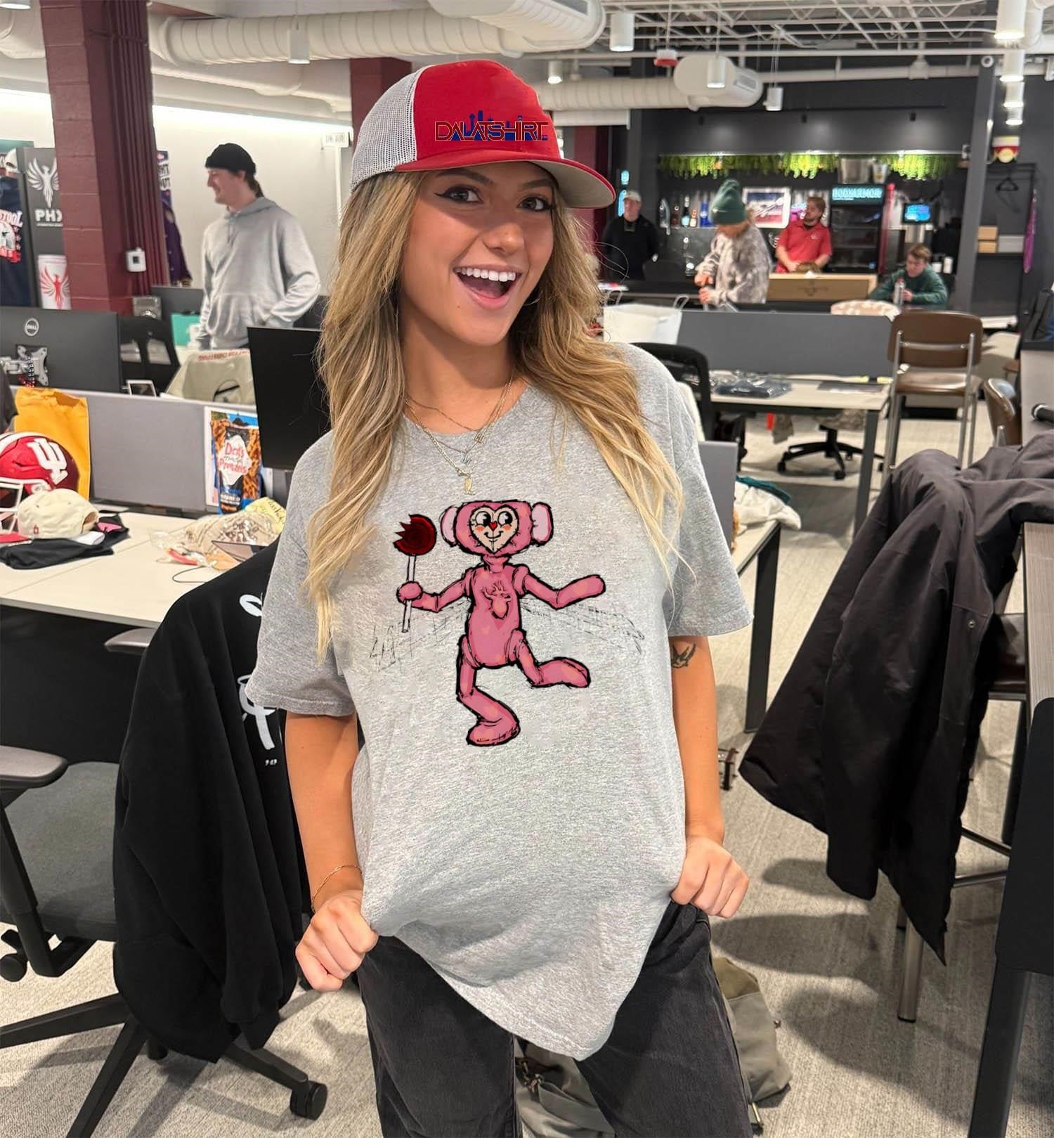 Pink heart face character holding a bitten red lollipop shirt