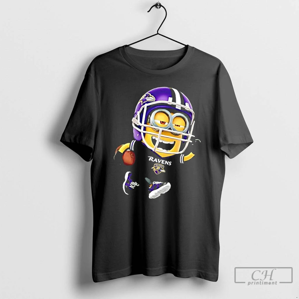 Premium Minions Is Holding A Ball And Smiling At Baltimore Ravens T Shirts