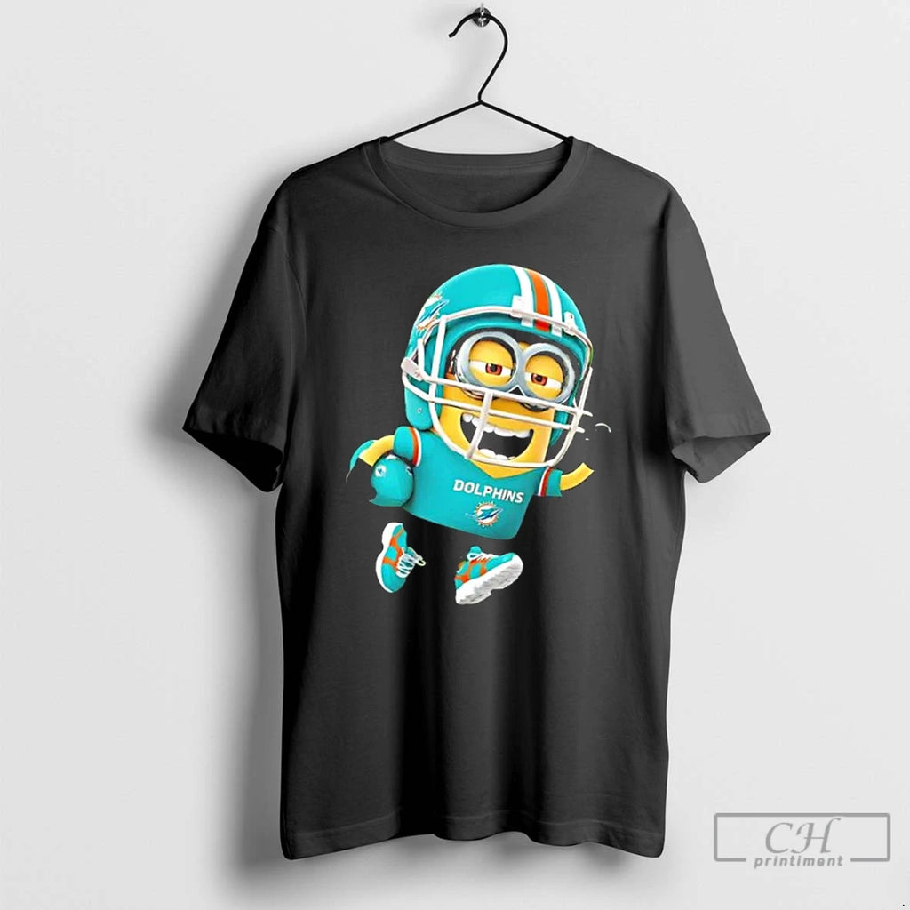 Premium Minions Is Holding A Ball And Smiling At Miami Dolphins Fans T Shirts