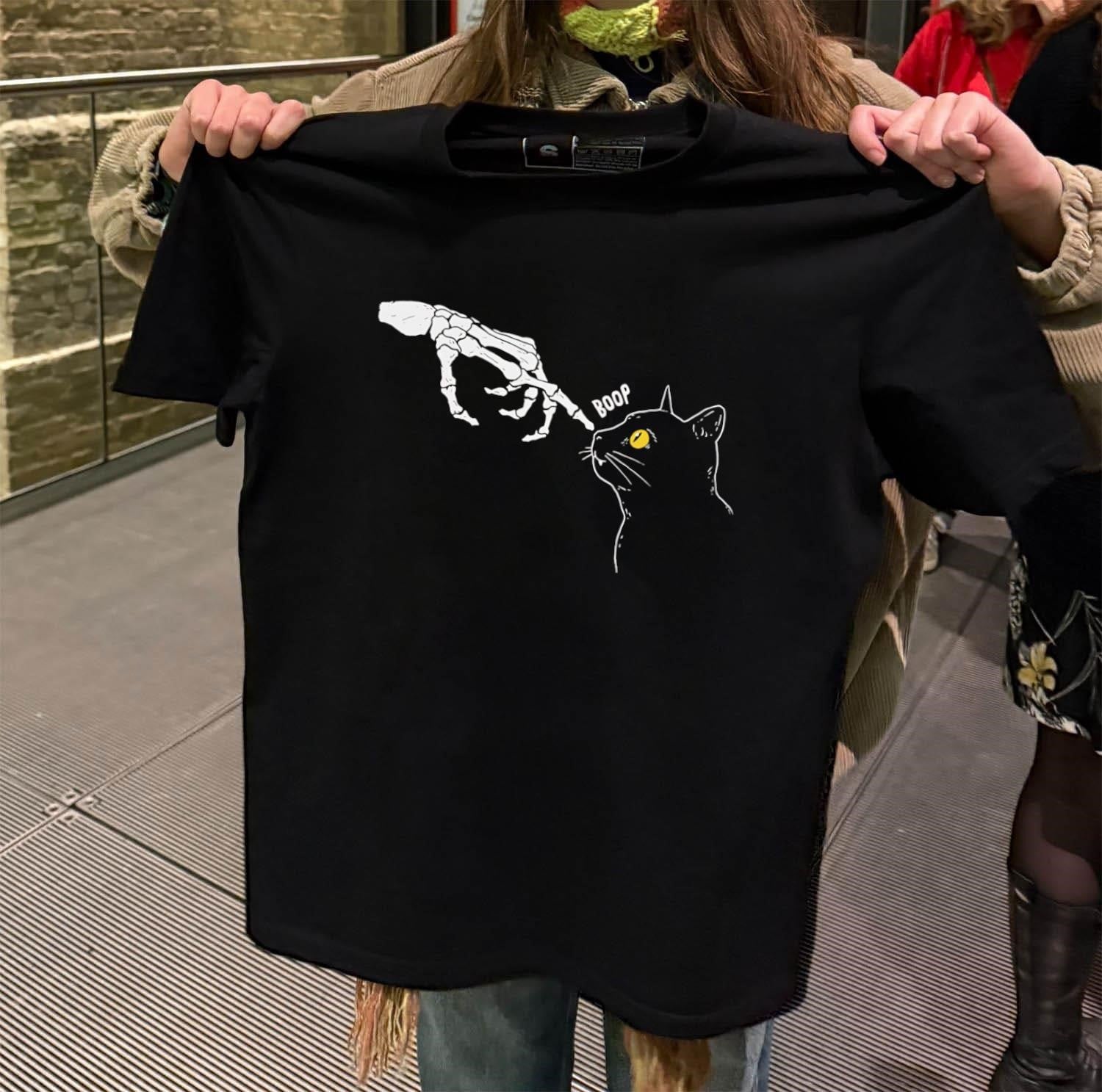 Skeleton hand touching black cat nose shirt