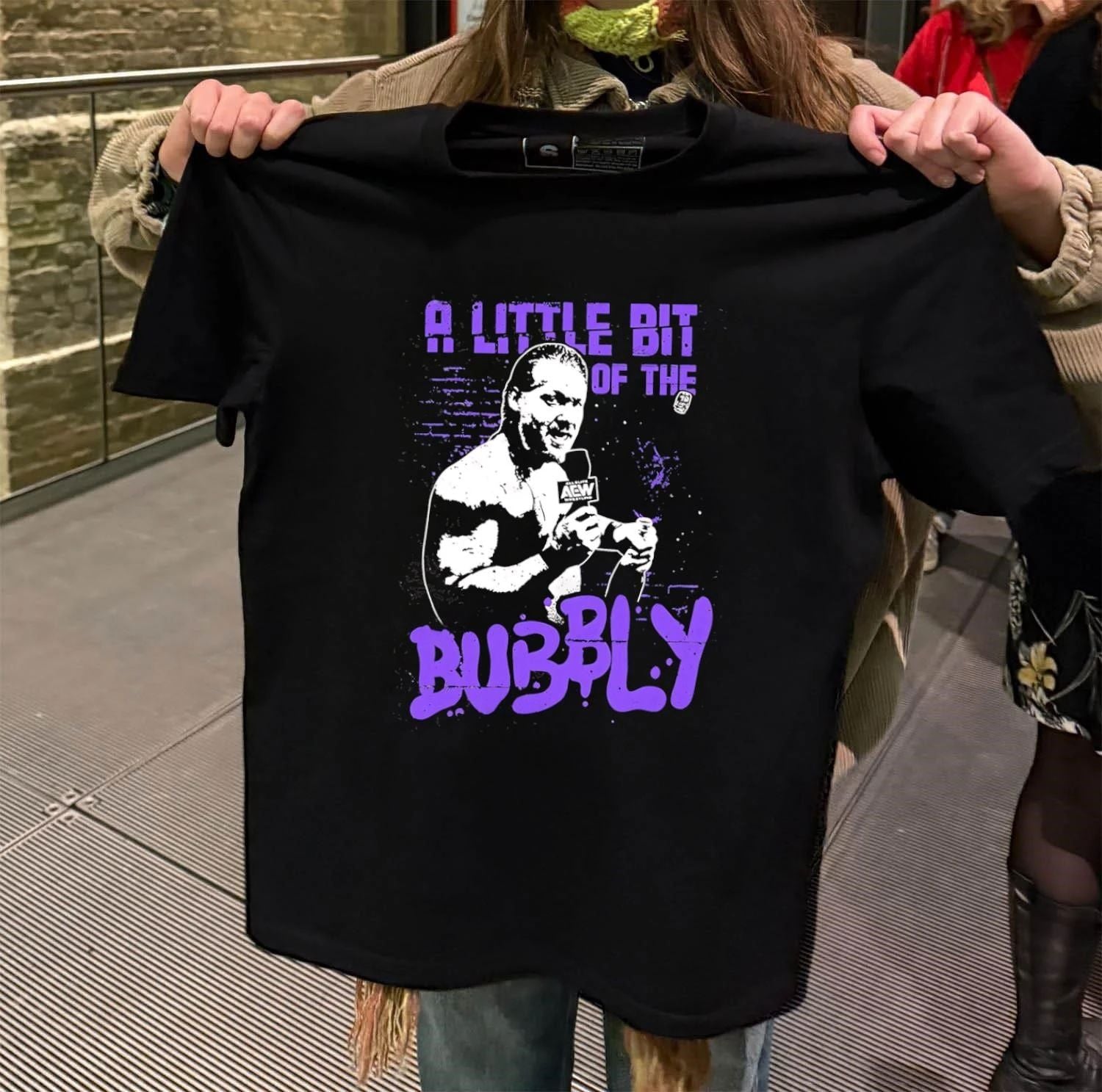 AEW Chris Jericho a little bit of the bubbly shirt