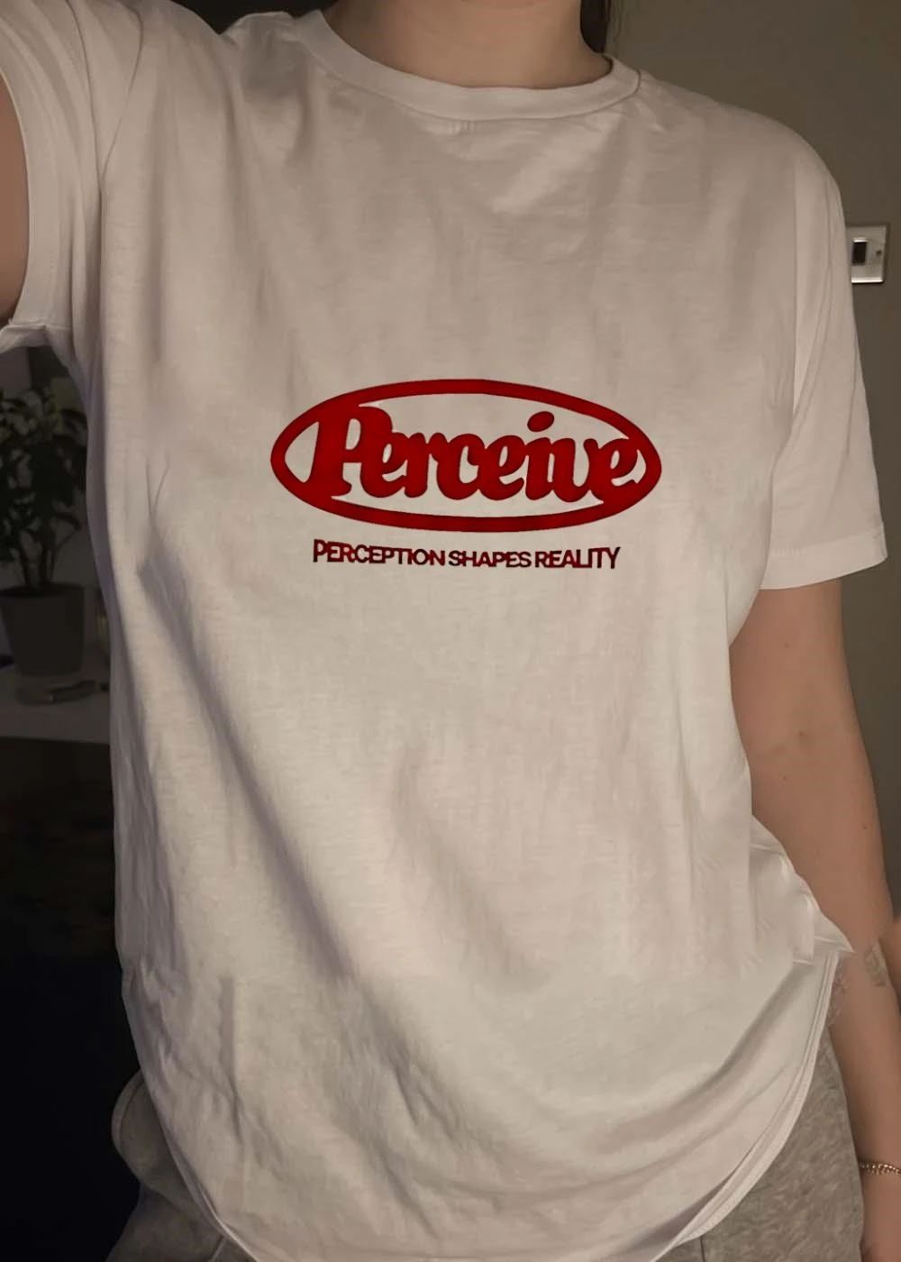 Perceive Red Oval Logo Perception Shapes Reality Slogan Shirt